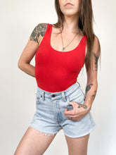 Load image into Gallery viewer, Vintage 90s Levis Light Wash Cut Off Jean Shorts Waist 28”