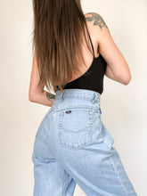 Load image into Gallery viewer, Vintage 90s Chic Light Wash High Rise Raw Hem Jeans Waist 28”